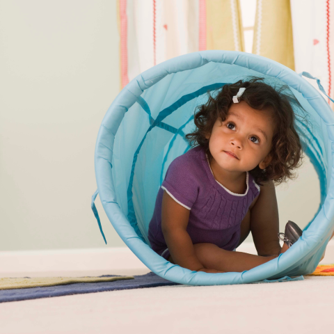 toddler in tunnel